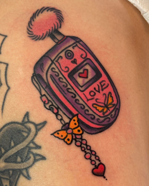 2026 tattoo trends NOSTALGIC THEMES flip phone tattoo